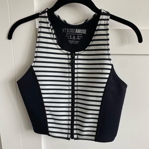 Neoprene crop top with zipper closure.